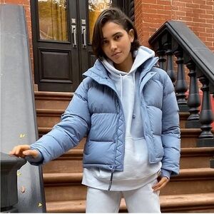 Aritzia the super puff jacket in a light matte dusty blue